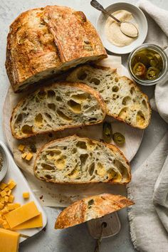 sliced bread with olives and cheese on a plate