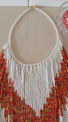 African beaded necklace, Multi-strand necklace, Fringe necklace, Masai necklace, Women jewelry, Christmas gift for her, Beaded jewelry An authentic elegant necklace that can match with any outfit. 100% handmade Closure: hook Color: White(main color), multicolor Available in different colors of your taste. Neck width: 17 inches Fringe width 16 inches 3-5 days delivery via DHL Express The shipping fee is for the first item only and additional items ship for free. Feel free to send me a convo or e- Masai Necklace, African Beaded Necklace, African Beads Necklace, Necklace African, Fringe Necklace, Elegant Necklace, Christmas Gift For Her, Jewelry Christmas, African Beads