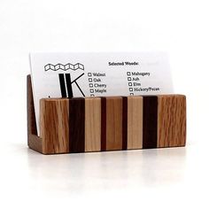 a business card holder made out of wood