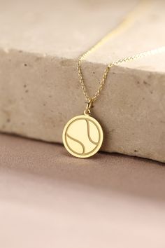 Gold Tennis Ball Pendant - Tennis Gold Necklace ● Material of pendant: Solid Gold 14k ( REAL GOLD ) ● Metal Stamp: 14k ( REAL GOLD ) ● The pendant is available in 5 sizes: - 12,7 mm / 0.5 inches (Diameter) - 14,0 mm / 0,55 inches ( Diameter ) In the photos - 15,3 mm / 0.6 inches ( Diameter ) - 16,5 mm / 0,65 inches ( Diameter ) - 19,1 mm / 0,75 inches ( Diameter ) ( In the photos the size is 14mm / 0.55 inches Diameter ) ( Jump Ring inner diameter: 4 mm ) ● Material of chain: Solid gold 14k ( RE Sporty Personalized Necklaces For Sports, Personalized Round Sports Jewelry, Tennis Core, Tennis Jewelry, Sports Jewelry, Ball Necklace, Jewelry Birthday, Tennis Necklace, Ball Pendant