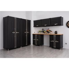 a room with black cabinets and a dart on the wall