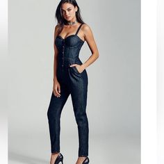 Dark-Wash Denim Jumpsuit Features Bustier Design, Button Detail And Slash Pockets. Back Zipper Closure. Pads Have Been Removed From Bustier Adjustable Straps Bustier Underwire Fitted Denim Blue Jumpsuit For Night Out, Fitted High Waist Denim Jumpsuit For Night Out, Chic Fitted Denim Jumpsuit Overall, Chic Fitted Denim Jumpsuit, Chic High-waist Denim Blue Overalls, Denim Jumpsuits And Rompers For Night Out, High Waist Denim Jumpsuit For Night Out, Fitted Denim Blue Jumpsuit Overall, Chic Dark Wash High Waist Jumpsuits And Rompers