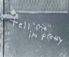 graffiti written on the side of a building that says tell it's not in poetry