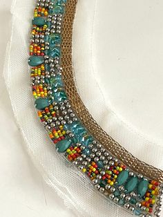 "Beaded Stone, Pave Chain Neckline Collar Applique, Bridal Applique,Stone Beaded, Silver Ball, Round Neckline Statement Boho Chic Bib, Make A Statement with this beautiful multi color bead work collar applique! Mesh Size 12\" W x 2 3/4\" L Bead Length: 1 3/8\" Long" Party Embellished Beaded Necklaces With Round Beads, Bohemian Beaded Necklaces For Summer Party, Bohemian Embellished Necklaces For Party, Summer Bohemian Beaded Necklaces For Party, Bohemian Embellished Necklace For Party, Summer Party Bohemian Beaded Necklaces, Bohemian Party Beads For Summer, Bohemian Beads For Summer Party, Handmade Gold Bib Necklace With Round Beads