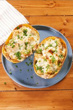 two stuffed squash halves on a blue plate