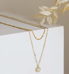 The necklace is hypoallergenic, waterproof, fade-resistant, and tarnish-free, ensuring its beauty lasts for years. Perfect for everyday wear or special occasions. Dainty Chain Necklace | Double Layered Necklace | Charm Necklace | Real Gold Dipped Necklace | Real Gold Plated Necklace | Waterproof & Sweatproof Necklace | Layering Necklace | Simple Minimalist Gold Necklace | Multi Strand Necklace Minimalist Gold Plated Double Chain Charm Necklace, Minimalist White Double Chain Necklace, Gold Plated Delicate Chain Necklace With Oval Pendant, Minimalist Stainless Steel Necklace With Double Chain, Minimalist Stainless Steel Double Chain Necklace, Minimalist Gold Plated Double Chain Necklaces, Minimalist Double Chain Gold Plated Necklace, Minimalist Double Chain Gold-plated Necklace, Minimalist Gold Chain Necklace With Oval Pendant