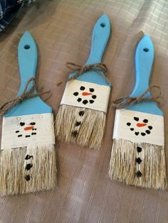 three snowmen made out of toothpicks on top of a bed