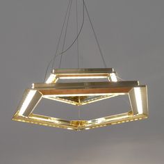 a modern light fixture hanging from the ceiling