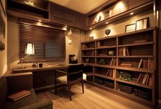 a home office with lots of bookshelves and shelves