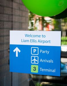 there is a sign that says welcome to llam ellis airport and party arrivals terminal