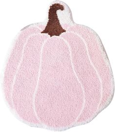 a pink rug with a brown and white pumpkin on it's front end, against a white background