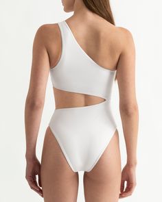 Anya one piece swimsuit effortlessly combines elegance and comfort, making it the perfect choice for any occasion. Its sleek design and form-fitting fabric provide a flattering silhouette, while the high-quality material ensures lasting comfort. Experience confidence and style with Anya. RECYCLED PA 78% EA 22%  Machine wash at max. 30ºC/86ºF with short spin cycle  Do not use bleach Do not iron Do not dry clean Do not tumble dry White Second-skin Swimwear For Summer, White Tight-fitting Swimwear For Summer, Chic One-piece Swimwear With Moderate Back Coverage, Modern Fitted Swimwear For Vacation, Chic Second-skin Lined Swimwear, Chic White Second-skin Swimwear, Second-skin One-piece Swimwear For Poolside, Modern Fitted Swimwear For Beach, Modern Solid Swimwear For Pool