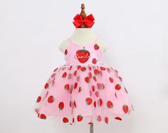 Dress your little princess in our adorable Strawberry Pattern Dress! Our charming Strawberry Pattern Dress designed to make your little one feel like a fairy tale princess. The dress features a soft tulle overlay that creates a beautiful, airy effect, perfect for twirling and dancing. Underneath, the dress is lined with smooth satin for comfort, while the top layer of delicate organza adds a luxurious touch. The dress is designed with a comfortable, fitted bodice that gently flares out into a fu Berry First Birthday Outfit, Berry First Birthday, Patriotic Dresses, Strawberry Dress, Strawberry Pattern, First Birthday Outfit, Smash Cake Photoshoot, Mid Calf Dresses, Personalized Baby Girl