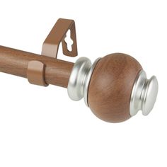 a close up of a wooden door handle on a white background with a metal ball