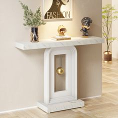 a white console table with a clock on it