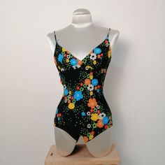 Beautiful and rare 1970s one piece swimwear, small size, in good condition just need a restoration in the connection between laces and top, easy to repair. The poly is still in vintage condition, wearable. Measure Bust cm flat 27 cm flat  Waist cm flat 22 cm flat Retro One-piece Swimwear For Vacation, Vintage One-piece Swimwear For Beach, Vintage One-piece Swimwear For Vacation, Retro One-piece Swimwear For Beach, Retro Sleeveless Swimwear For Beach, Vintage Multicolor Swimwear For The Beach, Vintage Green Swimwear For Summer, Vintage Multicolor Swimwear For Beach, Retro Swimwear For Spring