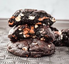 three chocolate cookies stacked on top of each other