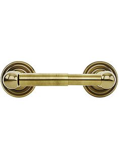 an antique brass door handle on a white background