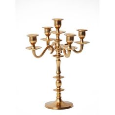 a gold candelabra with five candles on it