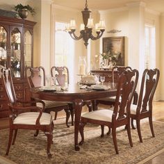 a dining room table with chairs around it