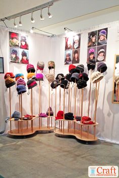 several hats are on display in a room