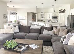 a living room filled with lots of furniture and decor