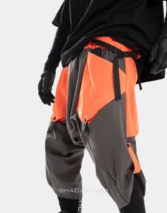 Design: Cyberpunk Technical pants: This techwear pants is the perfect garment to complete your Techwear outfit. Breathable materials: This techwear hoodie made of polyester, cotton and spandex can be worn all year round. Suitable for men and women Machine washable: 30 °C (86 °F) FREE worldwide shipping Size(cm) Waist Length Hip M 75 57 118 L 79 58 122 XL 83 59 126 Harem orange techwear pants These pants feature a unique orange and grey color scheme, adding a pop of color to your wardrobe while m Orange Techwear, Techwear Hoodie, Techwear Pants, Techwear Outfits, Pant Chains, Combat Pants, Grey Color Scheme, Chest Rig, Vest Shirt