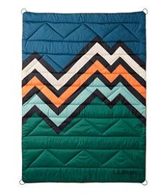 a blue and green quilt with an orange, white, and black zigzag design