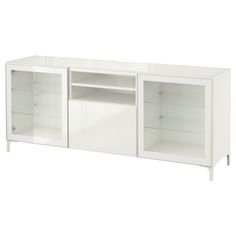 a white entertainment center with glass doors and shelves on both sides, in front of a white background