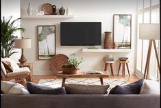 a living room filled with furniture and a flat screen tv