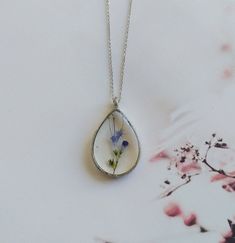 "Real flower necklace, woodland necklace, terrarium necklace, botanical necklace, real flower pendant, pressed flower necklace, resin finding These unique handcrafted necklaces are designed specifically for you! Made with natural flowers from the wild, this necklace is dainty, lightweight and it makes a perfect statement. Every VBRTN item is handmade with care in my Denver, CO studio. As someone that has passion for creating timeless healing pieces that you will fall in love with, I strive to tr Nature-inspired Birth Flower Necklace, Nature-inspired Flower Necklace With Pressed Flowers, Nature-inspired Flower Pendant Necklace With Pressed Flowers, Dainty Pressed Flowers Pendant Necklace, Minimalist Sterling Silver Necklace With Pressed Flowers, Botanical Flower Jewelry With Pressed Flowers, Botanical Flower Jewelry With Natural Inclusions, Delicate Sterling Silver Necklace With Pressed Flowers, Bohemian Pendant Necklaces With Pressed Flowers