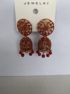 Indian style jhumka earrings. Vintage style. Costume jewellery. Heavy Drop Earrings Jhumkas, Heavy Drop Jhumkas, Traditional Chandbali Clip-on Earrings, Bollywood Style Earrings For Navratri With Pierced Ears, Navratri Earrings For Pierced Ears, Metal Earrings For Party And Navratri, Festive Red Jhumkas With Intricate Design, Red Jhumkas With Intricate Design For Diwali, Bollywood Red Earrings For Eid