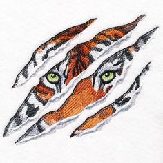 an orange tiger's face with green eyes is seen through the hole in white paper