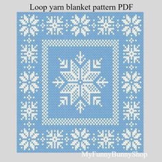 a blue and white knitted pattern with snowflakes