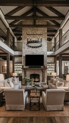 a living room filled with lots of furniture and a flat screen tv mounted to the wall