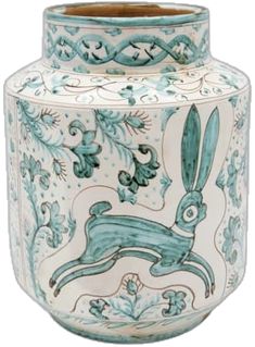 a blue and white vase with an image of a rabbit on the inside of it