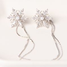 These Beautiful Snowflake Linear Earring Can Be Worn 2 Different Ways And Comes With 2 Different Backings. You Can Wear Them As Linear Drop Earrings Or As A Snowflake Studs. - Imported - Rhodium Plated/ Cubic Zirconia - Colors: Rose Gold And Silver ** Each Color Sold Separately. Please Choose Your Color Under Size Option ** - Sterling Silver Post Back ** Sterling Silver Posts Are Naturally Soft Due To The High Silver Content (Just Carefully Bend 'Em Back Into Shape If Needed) ** Elegant Snowflake Earrings For Winter, Elegant Winter Earrings For Party, Silver Snowflake Earrings For Pierced Ears, Silver Jewelry For Winter Parties, Elegant Winter Earrings For Pierced Ears, Elegant Winter Earrings, Silver Snowflake Cubic Zirconia Earrings, Elegant Silver Earrings For Christmas, Elegant Snowflake Earrings For Parties