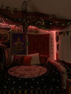 a bed room with a neatly made bed and lots of decorations on the wall above it