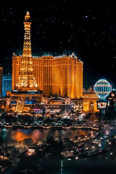 the eiffel tower is lit up at night in las vegas, nv