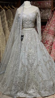 Cloudy grey intricate with fully sequence, studs motifs thread embroidery and crystal stone work lehenga embellished with pearl design paired with high neck blouse and net dupatta. Fabric: Net Size:38 Ready to Ship! Indian Lehangas, Stone Work Lehenga, Embroidered Greeting Cards, Sequence Work Embroidery, Eid Fits, People Embroidery, Embroidery People, Embroidery Abstract, Embroidery Landscape