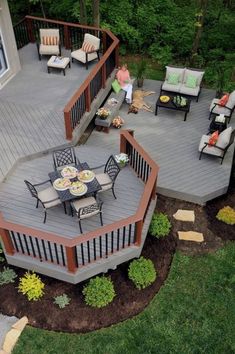 an aerial view of a deck with patio furniture