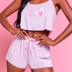 “Hold Onto Your Dreams”, And Wake Up As The Doll You Are In This Beautiful Authentic Barbie Two Piece Pajama Set. This Knit Pajama Set Features A Billowy Cami With A Front "Malibu Barbie" Text And Beach Crest Graphic And A Cropped Hem, As Well As A Pair Of Matching Shorts With A Drawstring Waistband. We Have It A Size Small, However With The Stretch And Drawstring Closure This Set Can Also Be Worn For Women Who Normally Wear A Size Medium. Short Loungewear Set For Beach Season, Summer Sleepwear For Lounging During Beach Season, Pink Summer Top For Lounging, Sleeveless Sleepwear For Beach Vacation, Pink Summer Sets For Pajama Party, Pink Pajama Shorts For Beach Season Loungewear, Sleeveless Sleepwear For Beach Season Loungewear, Pink Summer Sleepwear For Pajama Party, Sleeveless Summer Lounging Sets