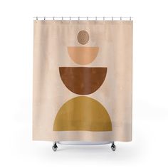 a shower curtain with an abstract design in gold and brown on the outside, along with a white background