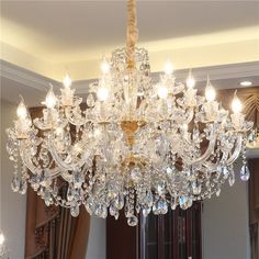 a chandelier hanging from the ceiling in a room