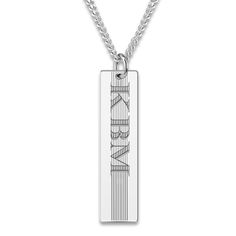 A lustrous textured, engravable bar pendant hangs handsomely in the center of this stylish men's necklace. Fashioned in sterling silver, the 22-inch curb chain secures in place with a lobster clasp. Personalize with up to 3 characters. Classic Stainless Steel Necklace With Rectangular Pendant, Silver Necklace With Engraved Rectangular Pendant, Classic Stainless Steel Rectangular Pendant Necklace, Engraved White Gold Necklace For Father's Day, Engraved White Gold Necklace, Silver Rectangular Pendant Necklace With Engraving Option, Classic Rectangular Jewelry With Engraved Text, Rectangular Sterling Silver Necklace With Engraved Text, Classic Silver Dog Tag Necklace