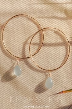 Aquamarine, the gem stone of sea goddess, is a calming gem stone said to be good for emotional centering. Encouraging selflessness and empathy, this gemstone balances energy and soothes the soul. Handcrafted in 14k gold filled jewelry or sterling silver, these simple and dainty earrings are gentle on the ears and built to last. Match them with any Kindness Gems necklace for a show stopping look! minimalist earrings | dainty earrings | gem stone earrings | simple gold hoops | gold jewelry Simplistic Jewelry, Statement Rings Unique, Gem Necklace, Gold Hoops, Dainty Earrings, Delicate Rings, Simple Earrings, Gems Jewelry, Jewelry Companies