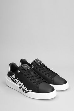 B court Sneakers in black leather, laces, logo on heel, logo print sole, side logo print, 100% leather, rubber outsole, Made in Italy | Balmain Men's B Court Sneakers in Black Leather | FW23/24 Luxury Black Sneakers With Embossed Logo, Balmain Sneakers Men, Luxury Low-top Sneakers With Embossed Logo, Luxury Black Low-top Sneakers, Luxury Black Suede Sneakers, Balmain Men, Embroidered Leather, Suede Sneakers, Logo Embroidered