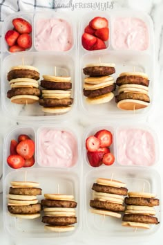 four plastic containers filled with food and strawberries on top of each other in them