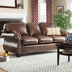 a living room filled with furniture and a fire place