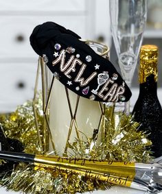 Introducing our "New Year's Eve Toast Headband" in sleek black – the perfect accessory to ring in the festivities with style. This black headband is adorned with the words "New Year" in gold and white seed beads, creating a chic and celebratory look that's perfect for your New Year's outfit.
Embellished with rhinestones and jewels, this headband adds a touch of glamour and sophistication to your ensemble. Whether you're counting down to midnight at a New Year's Eve party or celebrating in a more intimate setting, this headband is a stylish way to welcome the arrival of the new year.
Get ready to sparkle and shine as you toast to new beginnings with the "New Year's Eve Toast Headband" in black. It's the perfect accessory to complement your Happy New Year celebrations in a fashion-forw New Years Headbands, New Years Headband, New Year's Outfit, New Year Headband, To New Beginnings, New Years Outfit, New Year's Eve Party, Black Headband, Eve Parties